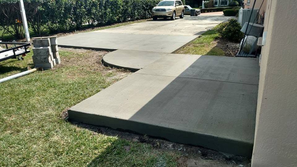 Wide concrete driveway along a home