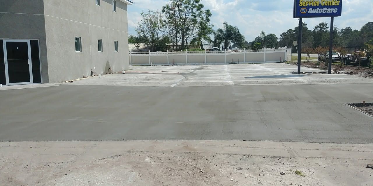 Commercial concrete lot beside a business